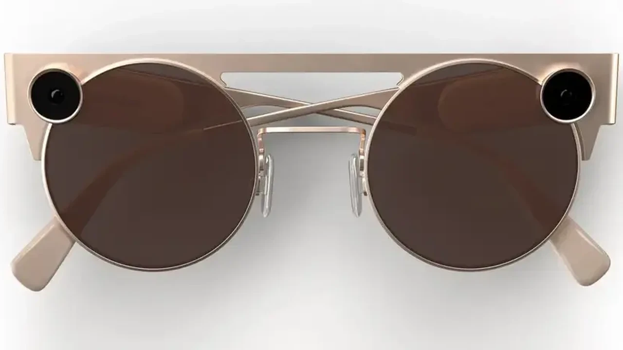 Close up on a plate of mashed potatoes, topped with baked pork chops with cream of mushroom soup, and a side of green beans.