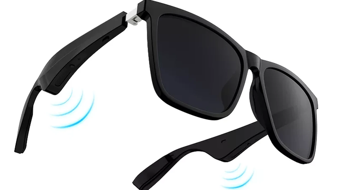 Close up on a plate of mashed potatoes, topped with baked pork chops with cream of mushroom soup, and a side of green beans.