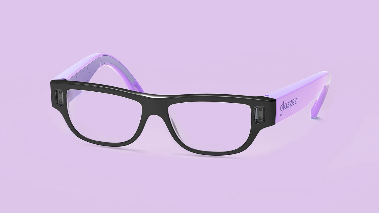 Close up on a plate of mashed potatoes, topped with baked pork chops with cream of mushroom soup, and a side of green beans.