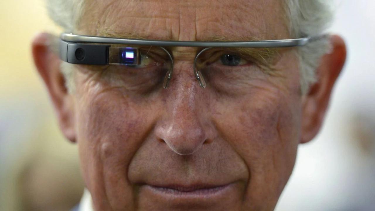 Close up on a plate of mashed potatoes, topped with baked pork chops with cream of mushroom soup, and a side of green beans.