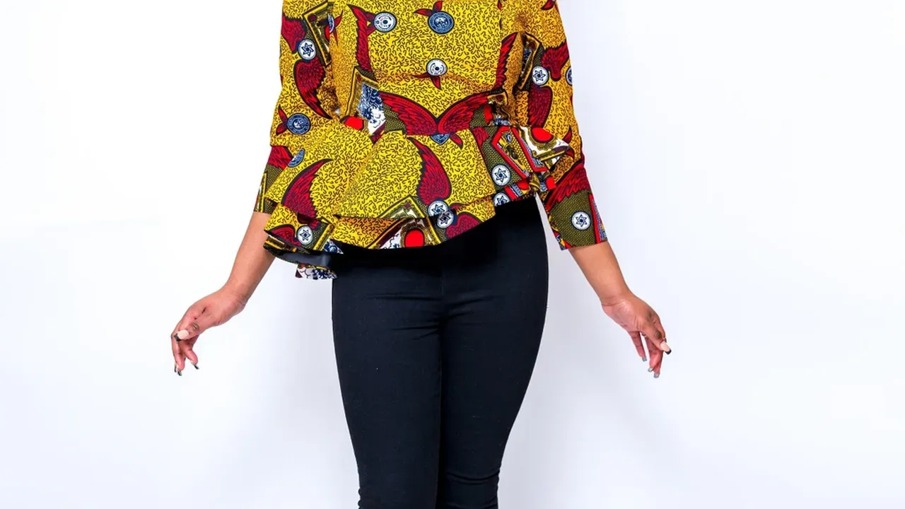 Close up on a plate of mashed potatoes, topped with baked pork chops with cream of mushroom soup, and a side of green beans.